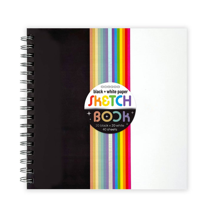 The sketchbook cover featuring a vibrant rainbow print with foil accents.