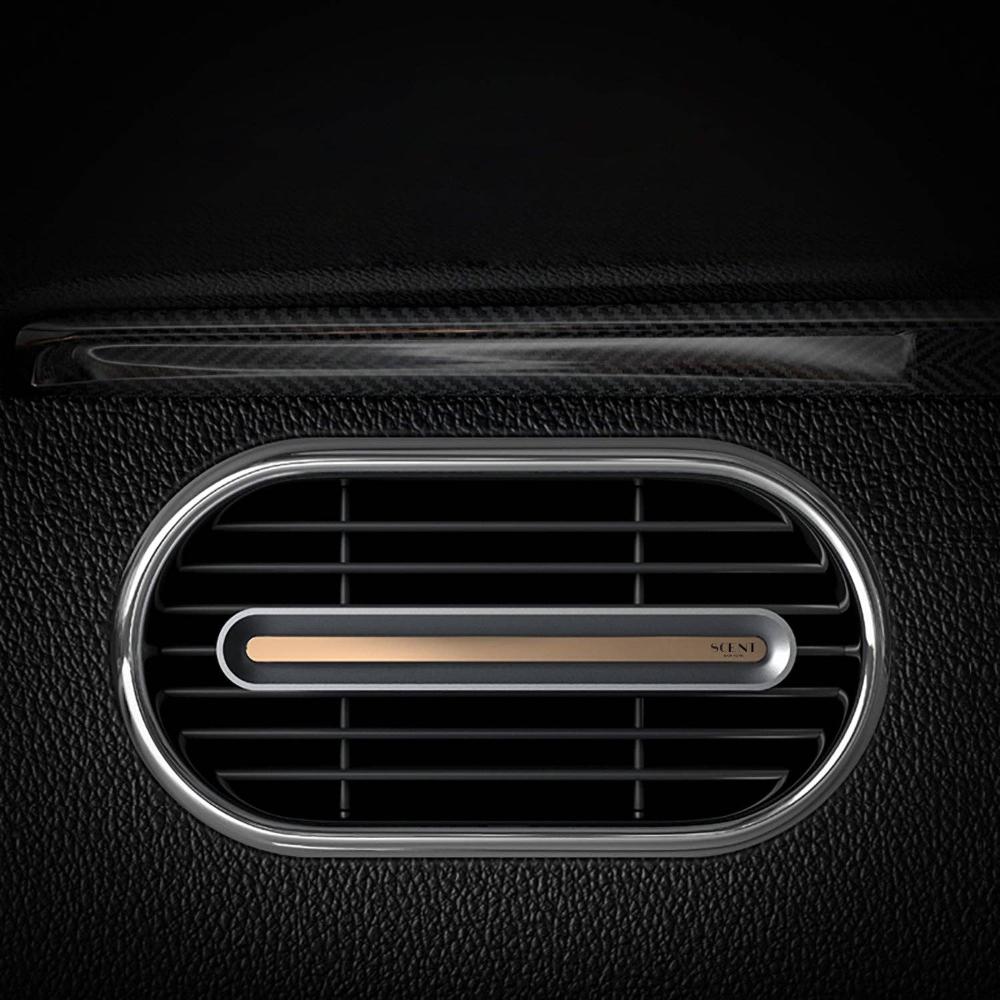 Sleek Bon Voyage Car Diffuser with metallic finish clipped onto a car vent.