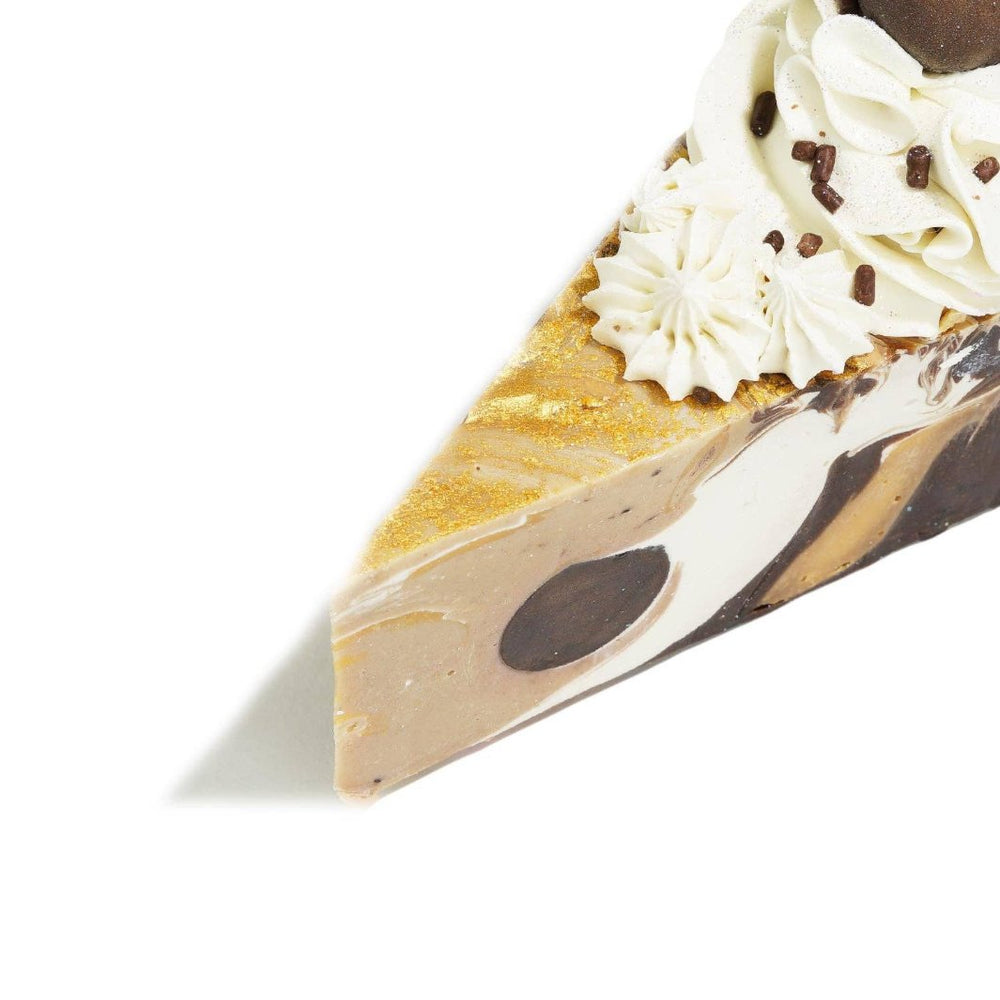 Close-up of chocolate cake soap slice showcasing detailed toppings.