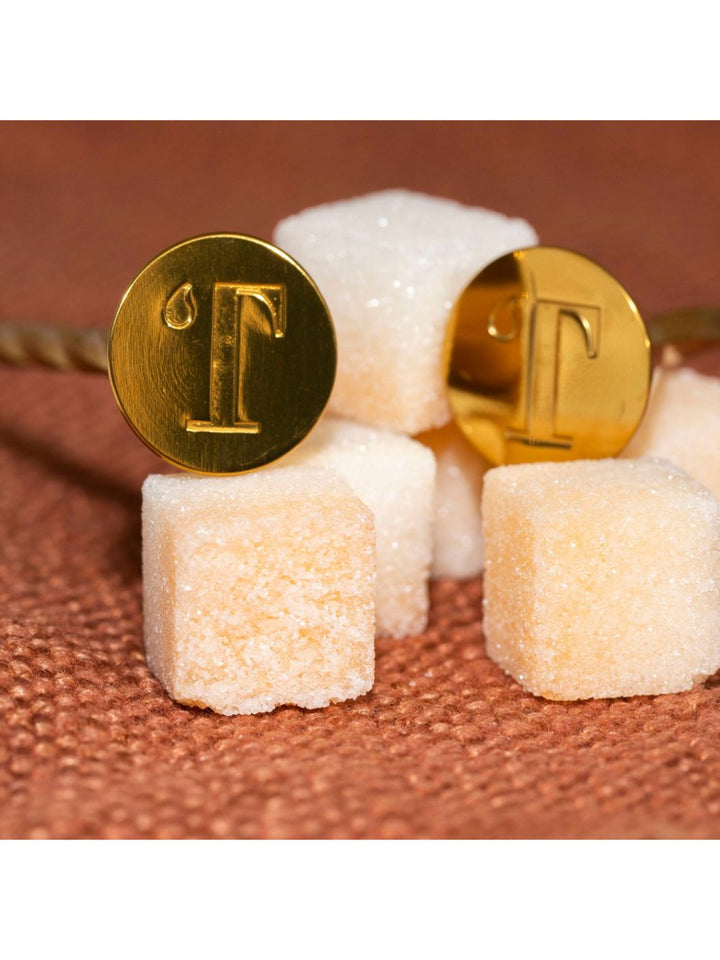 Bottom of the Gold Bar Spoon and Muddler is engraved with a letter T for Teaspressa.