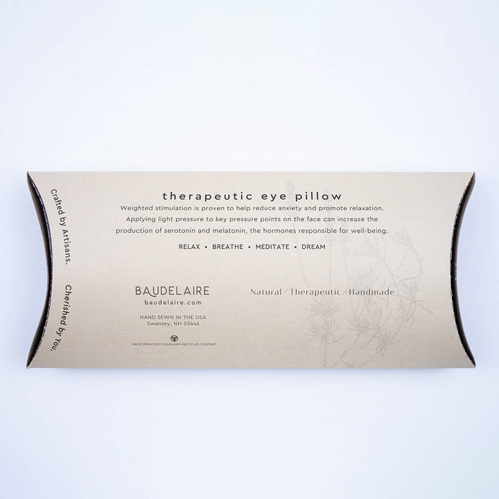 Image of back of packaging of Floral Laurel Eye Pillow. Therapeutic eye pillow benefits reduce anxiety, promote relaxation, increase production of serotonin and melatonin.