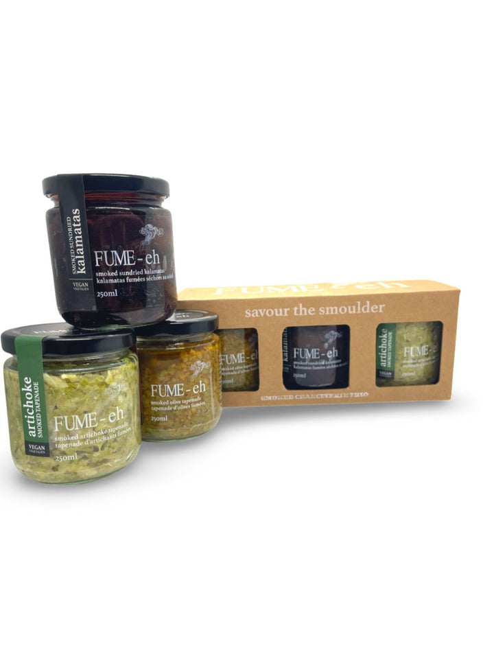 Charcuterie Trio by Fume-Eh Gourmet: Smoked Sundried Kalamatas, Smoked Olive Tapenade, and Smoked Artichoke Tapenade.