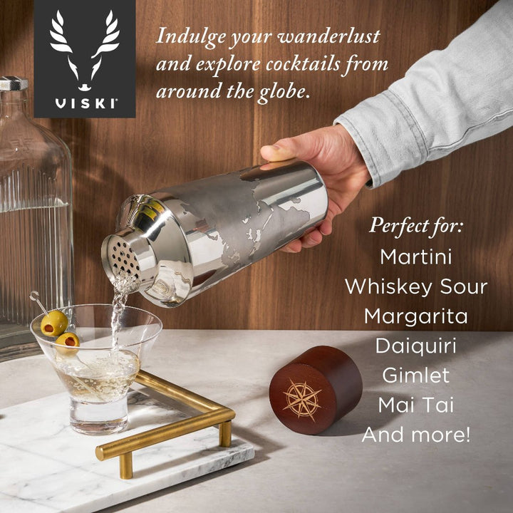 Three-piece Globe Cocktail Shaker with cap, strainer, and shaker in use