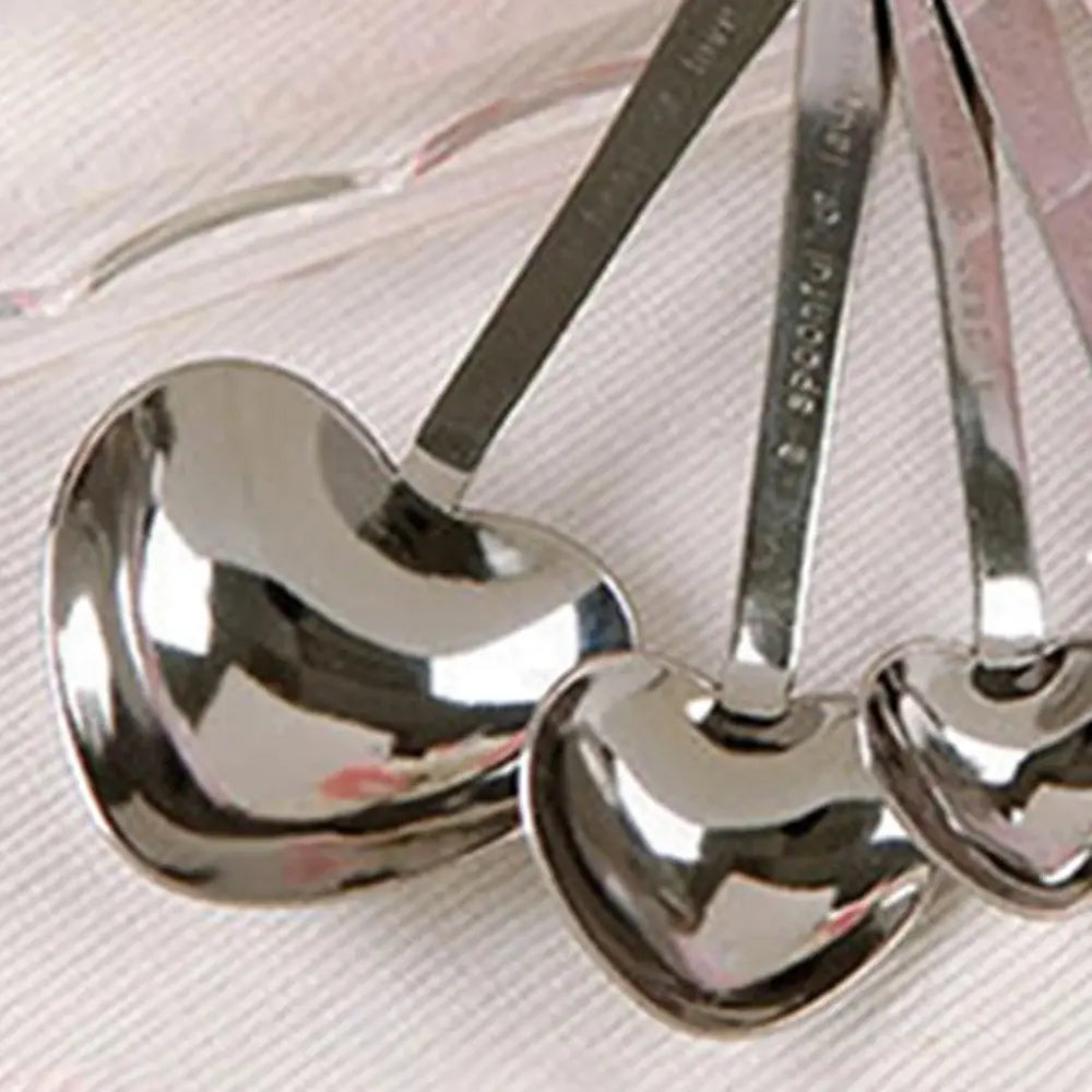 Close-up image of heart-shaped stainless steel measuring spoons.