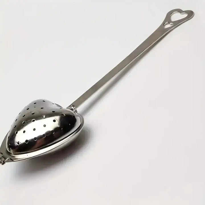 Close-up of stainless steel heart-shaped tea infuser showcasing durable craftsmanship.