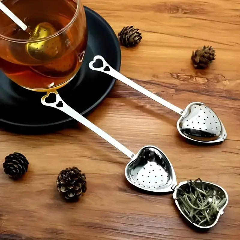 Tea and stylish heart-shaped stainless steel tea strainer.