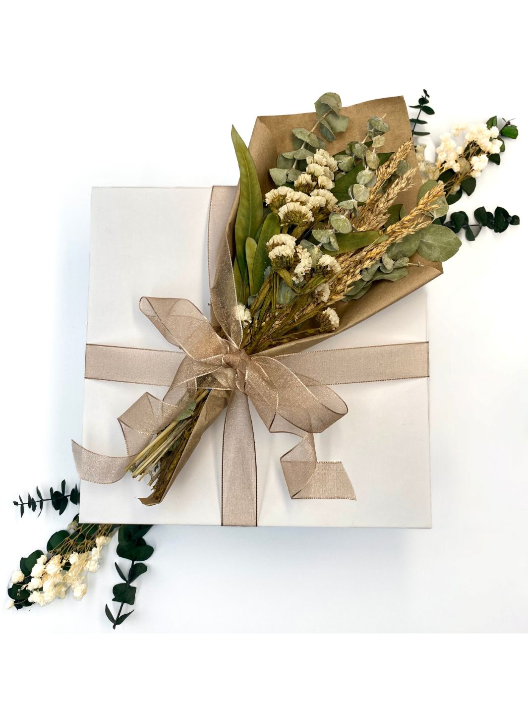 Healing Wishes Gift Box Exterior- Wrapped with organza ribbon and dried floral bouquet placed on top.