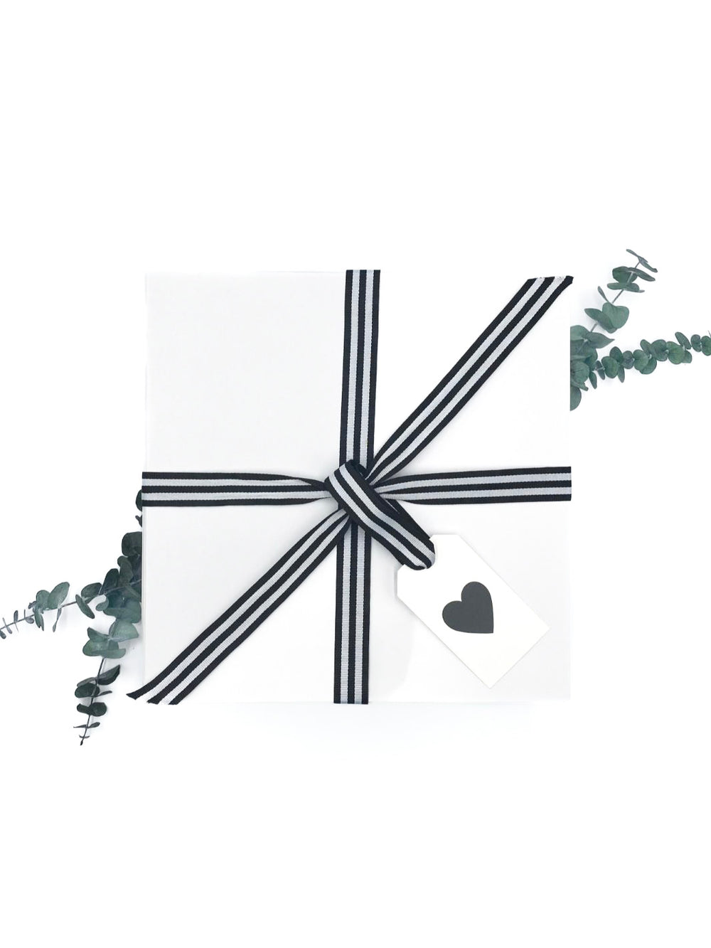 Love & Coffee Curated Gift Box adorned with black and white ribbon and heart gift tag