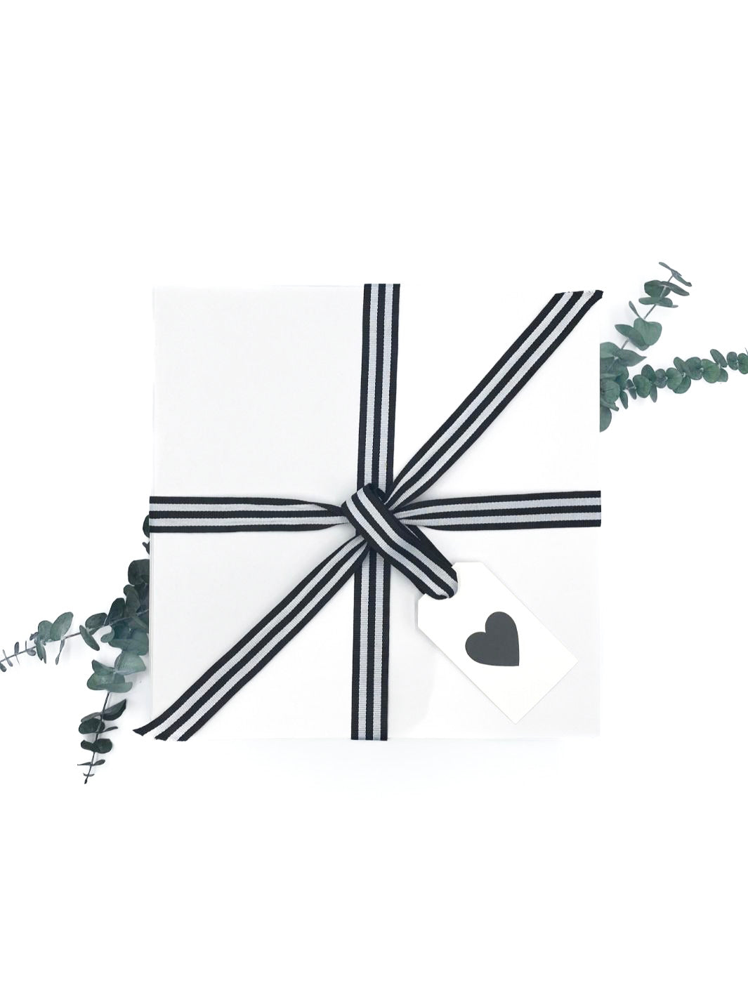Love & Coffee Curated Gift Box adorned with black and white ribbon and heart gift tag