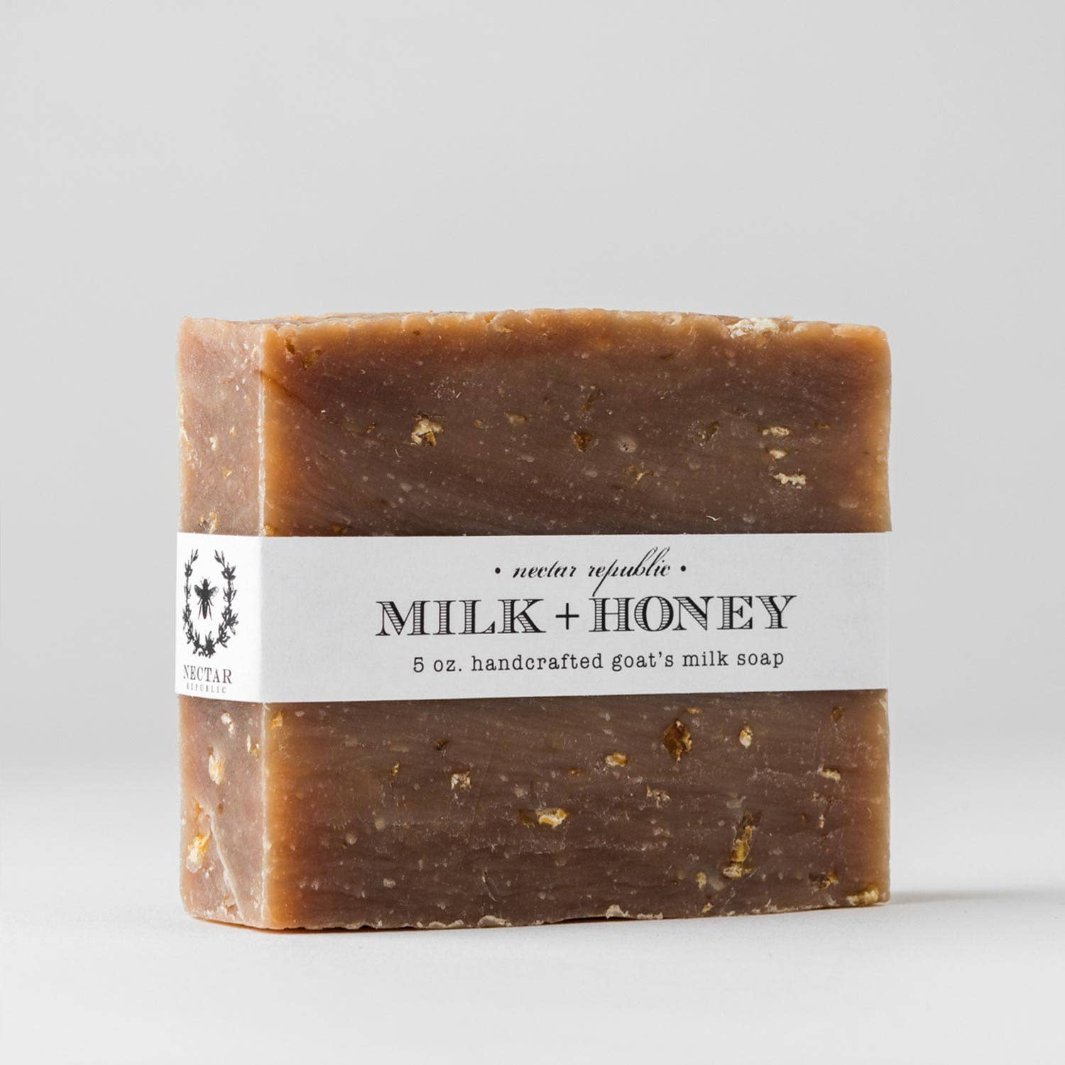 Close-up of the Milk + Honey soap bar showcasing its creamy texture and oatmeal flecks.