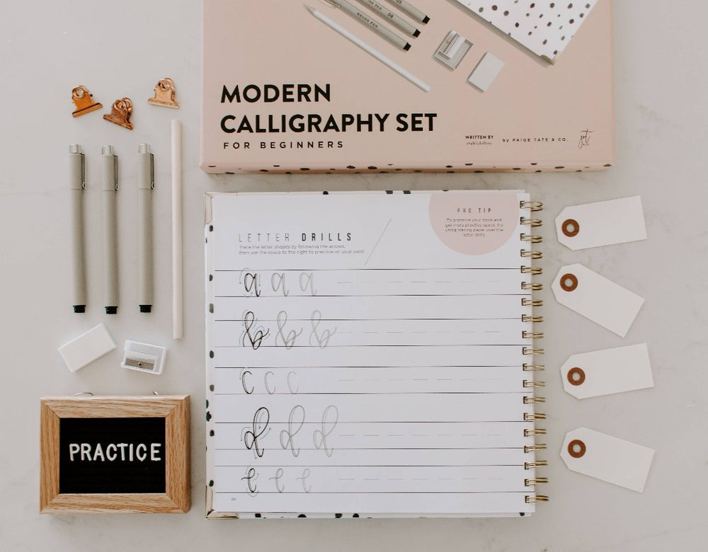 Sample Practice Page from Hand Lettering 101: A close-up of a practice sheet with hand-drawn letters in progress.