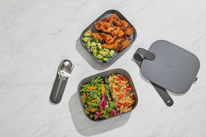 Bento Box Lunch Container with its removable trays separated, highlighting its storage capacity.