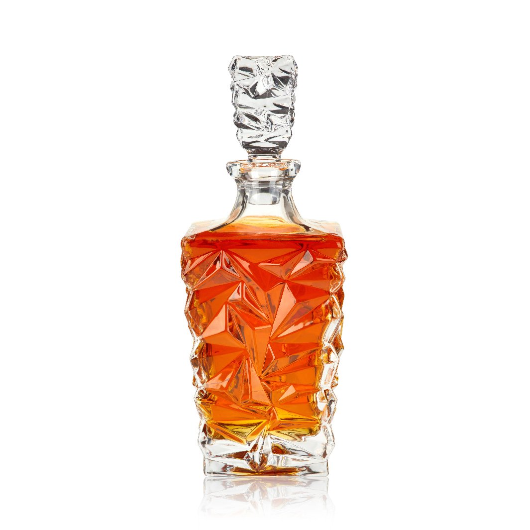 Prism Crystal Whiskey Decanter: A lead-free crystal whiskey decanter with gem-like angles and a sleek, elegant silhouette, holding 28.75 oz of whiskey.