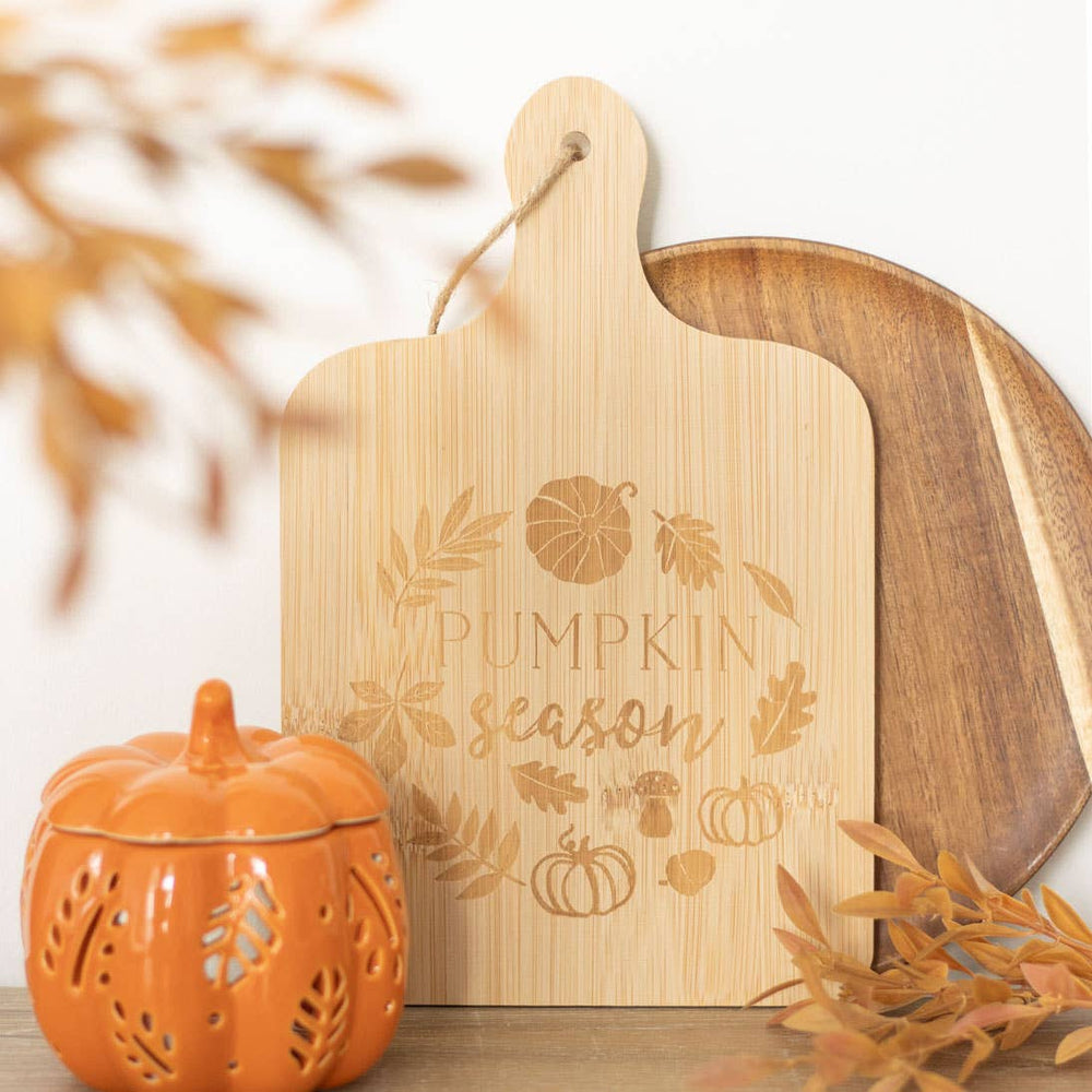 Bamboo wood serving board engraved with 'Pumpkin Season,' perfect for fall entertaining and displaying autumn treats.