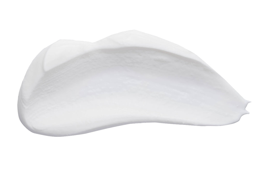 Close-up of rich, creamy texture of Radish Root Hand Crème showcasing luxurious moisturizing formula.