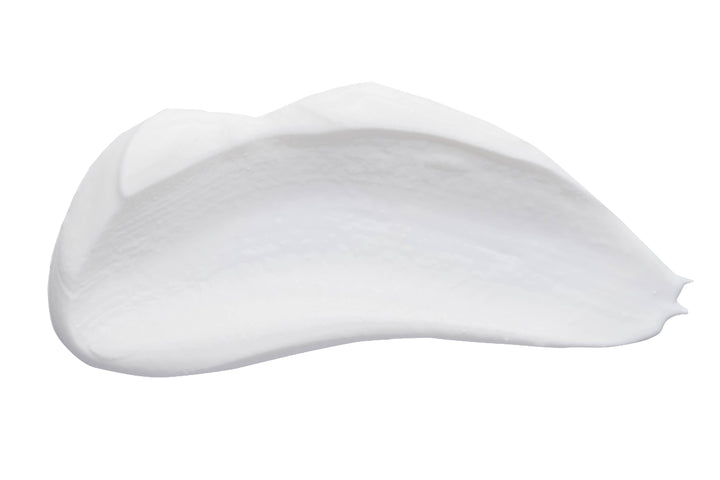 Close-up of rich, creamy texture of Radish Root Hand Crème showcasing luxurious moisturizing formula.