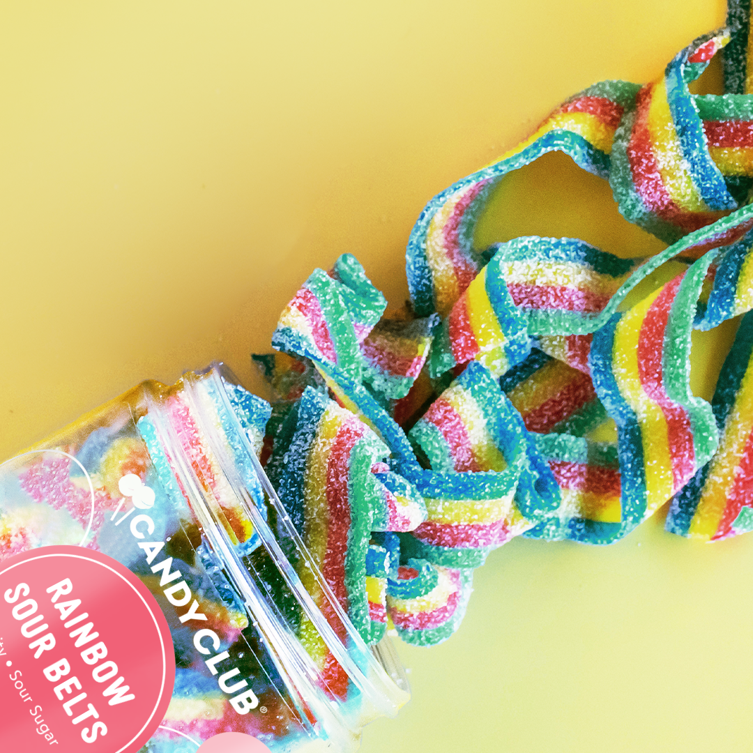 Close-up of vibrant Rainbow Sour Belts showing their multi-colored stripes and sugar-coated texture.