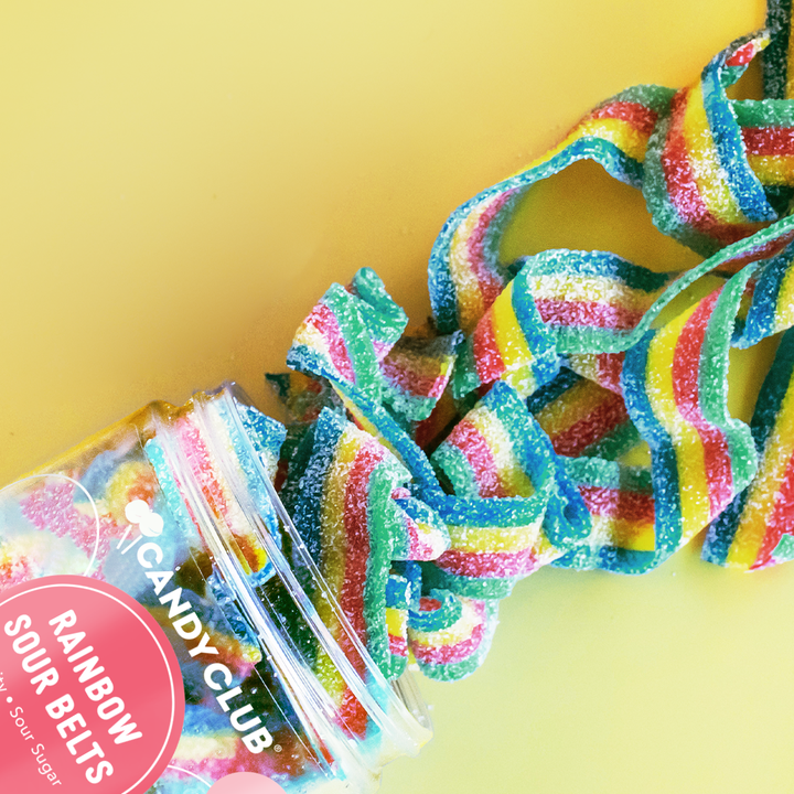 Close-up of vibrant Rainbow Sour Belts showing their multi-colored stripes and sugar-coated texture.