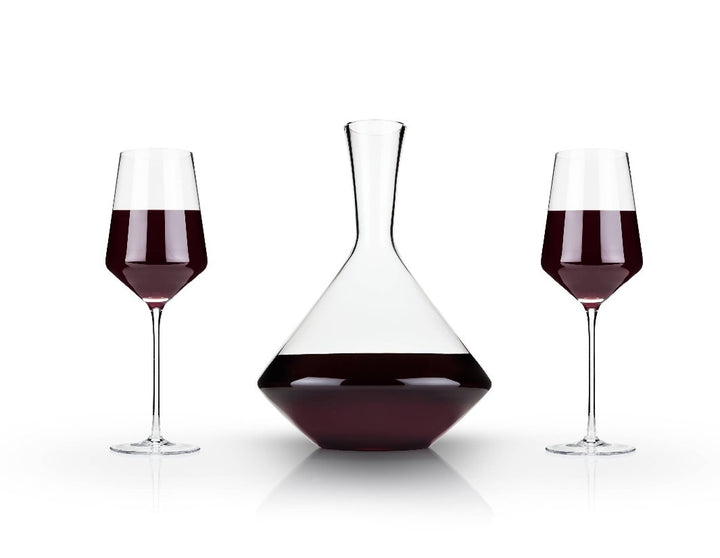 Raye™ Angled Crystal Decanter & Wine Glasses Set by Viski, featuring two Bordeaux glasses and an angled decanter in lead-free crystal