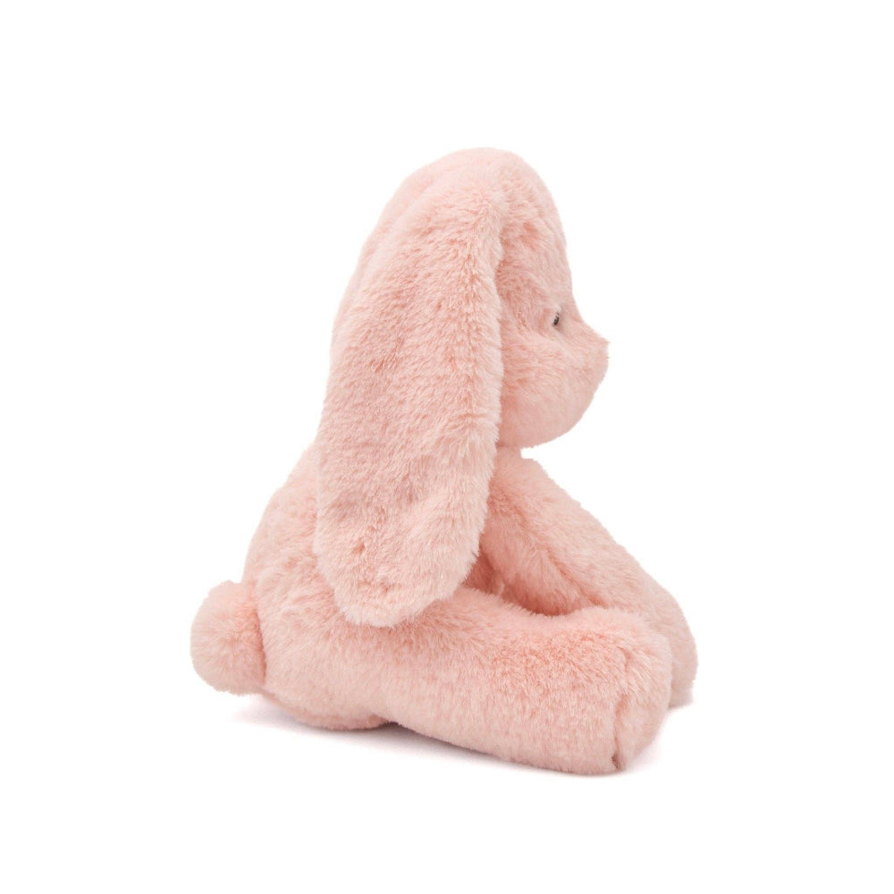 Side profile of Ruby dog plushie emphasizing floppy ears and cuddly body shape.