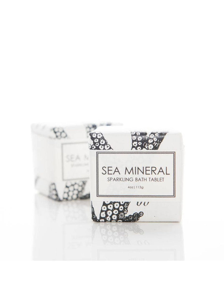 Sea Mineral Sparkling Bath Tablet by Formulary 55, featuring essential oils with notes of petitgrain, rosemary, and lavender. Fizzes and dissolves in water for a relaxing bath. Made in the USA.