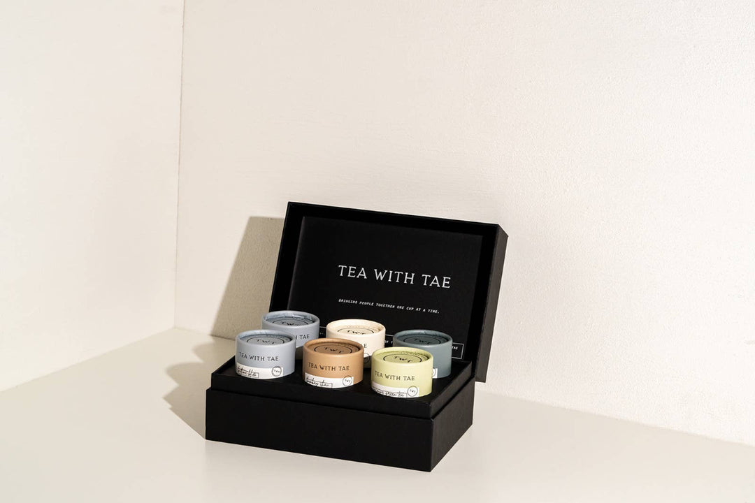 Spa Collection Tea Bento Box open to show colorful tea tubes and elegant packaging.