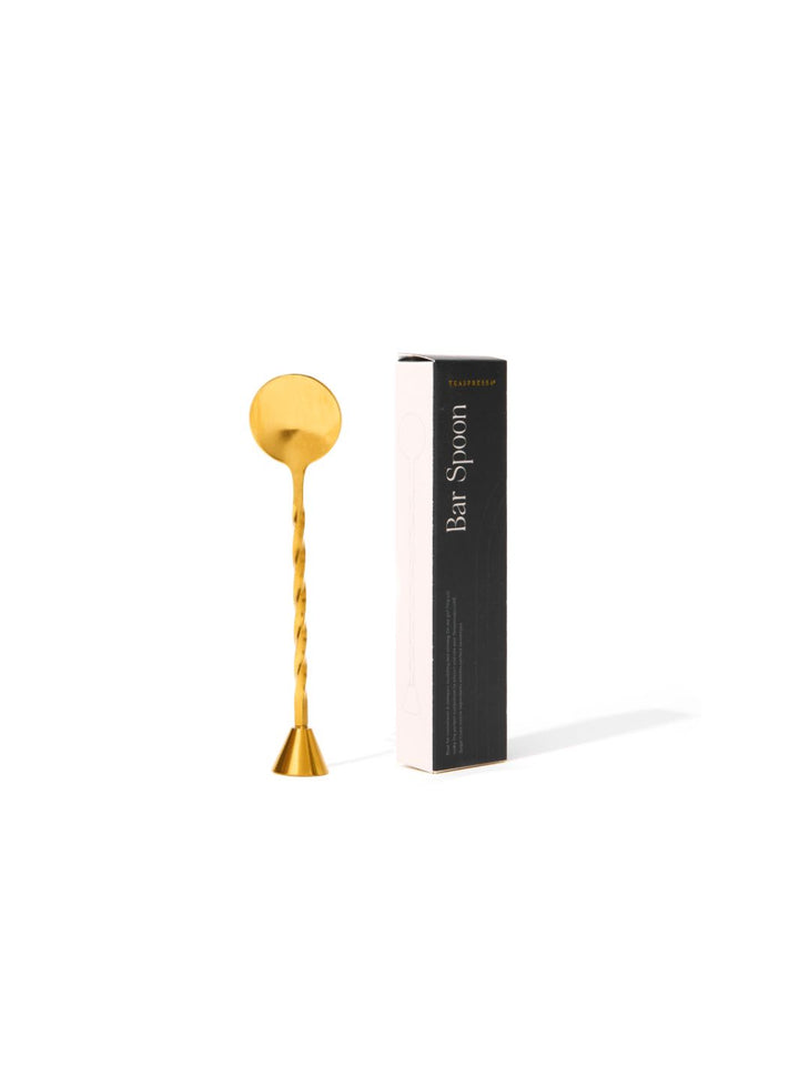 Gold bar spoon and muddler shown with packaging.