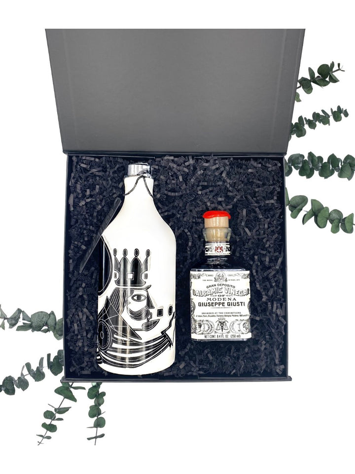 Contents of The King Gift Box, including Muraglia olive oil in a ceramic bottle and Giusti aged balsamic vinegar in a cubic bottle.