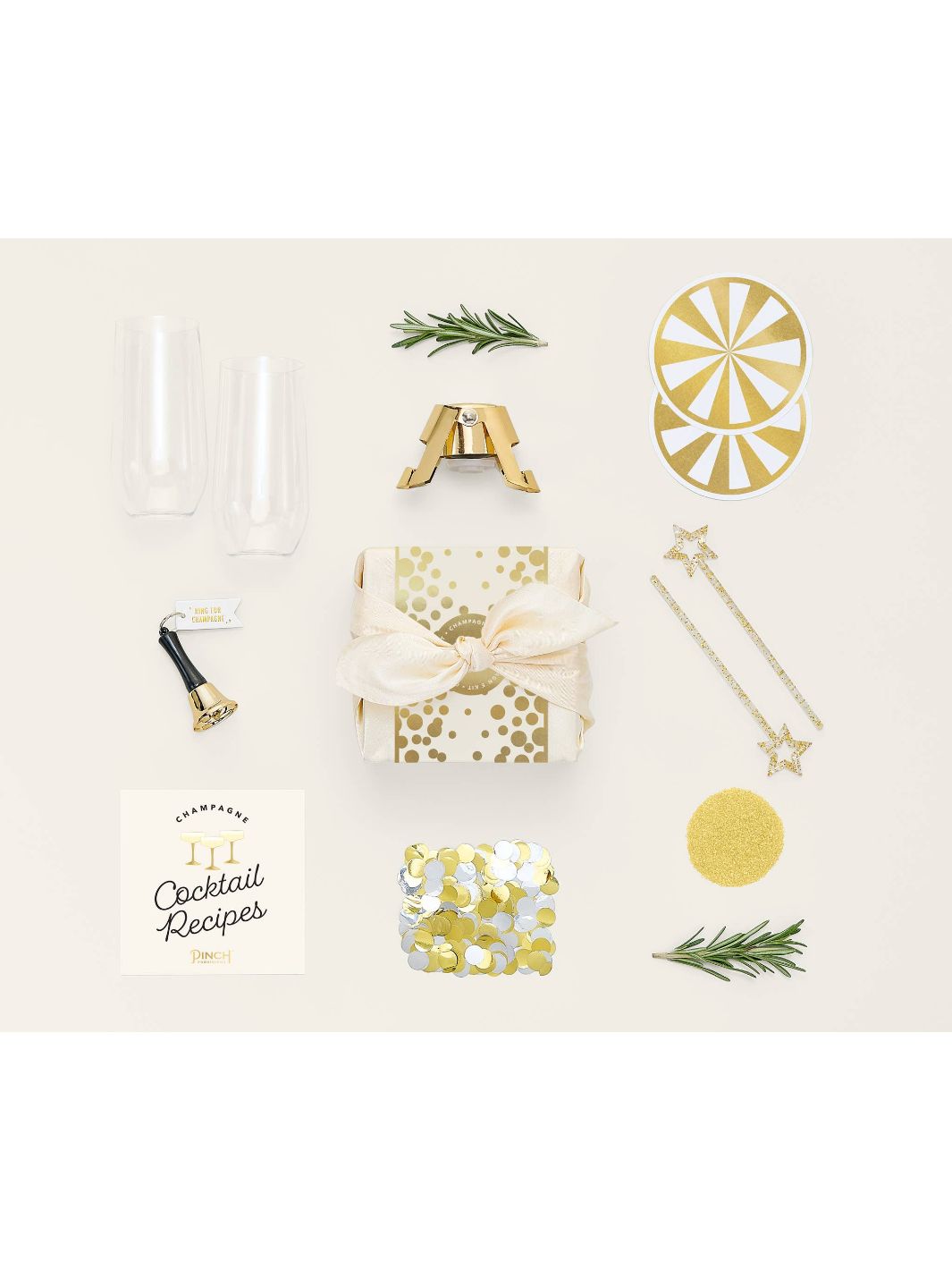 Kit contents: mini stemless champagne glasses, bottle stopper, edible glitter, and more.