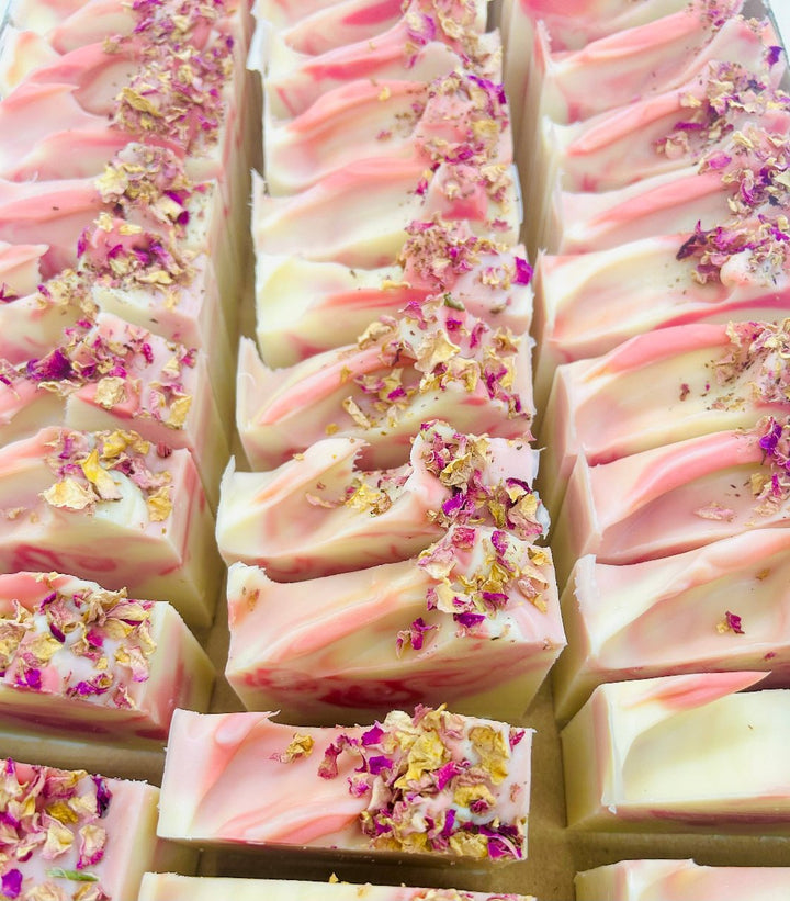 Close-up of the tops of Wild Rose Handmade Soap bars showcasing their delicate floral design.