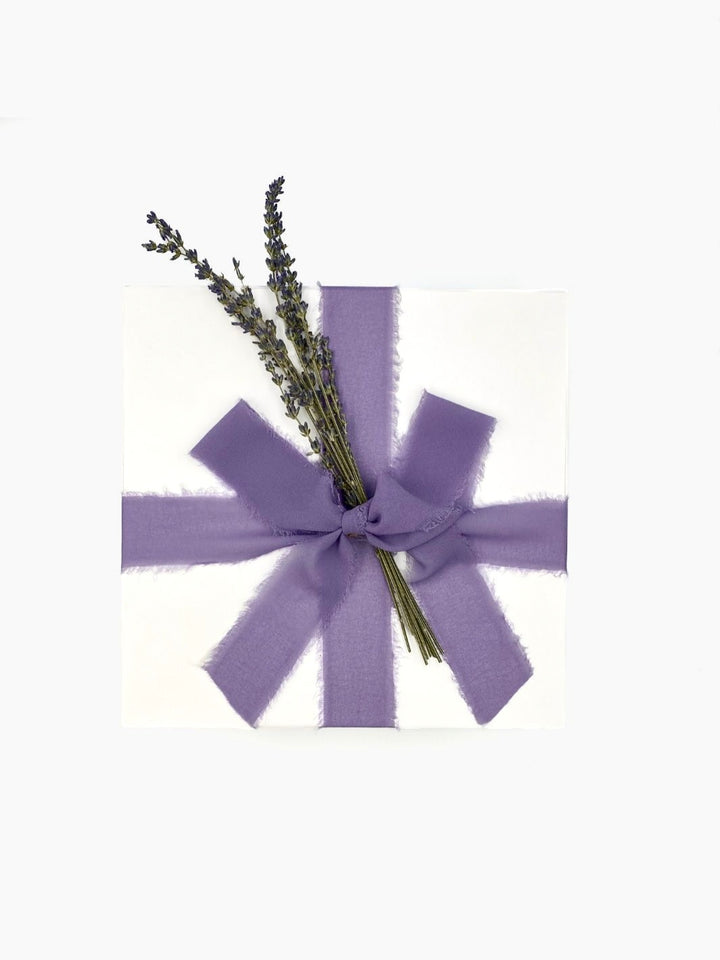 Wildflowers Gift Box wrapped in lilac purple chiffon ribbon and dried lavender decor.