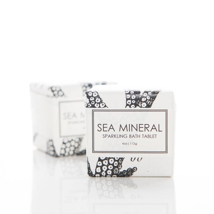 Sea Mineral Sparkling Bath Tablet by Formulary 55, featuring essential oils with notes of petitgrain, rosemary, and lavender. Fizzes and dissolves in water for a relaxing bath. Made in the USA.